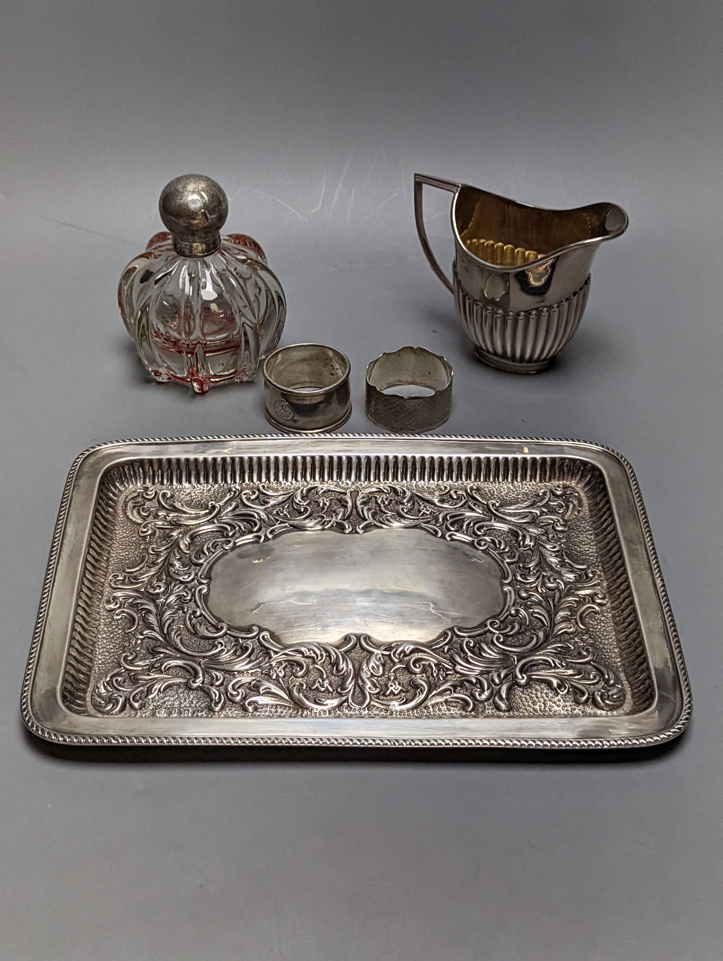 A late Victorian repousse silver rectangular dressing table tray, Joseph Gloster, Birmingham, 1899, 27.2cm, 10oz.